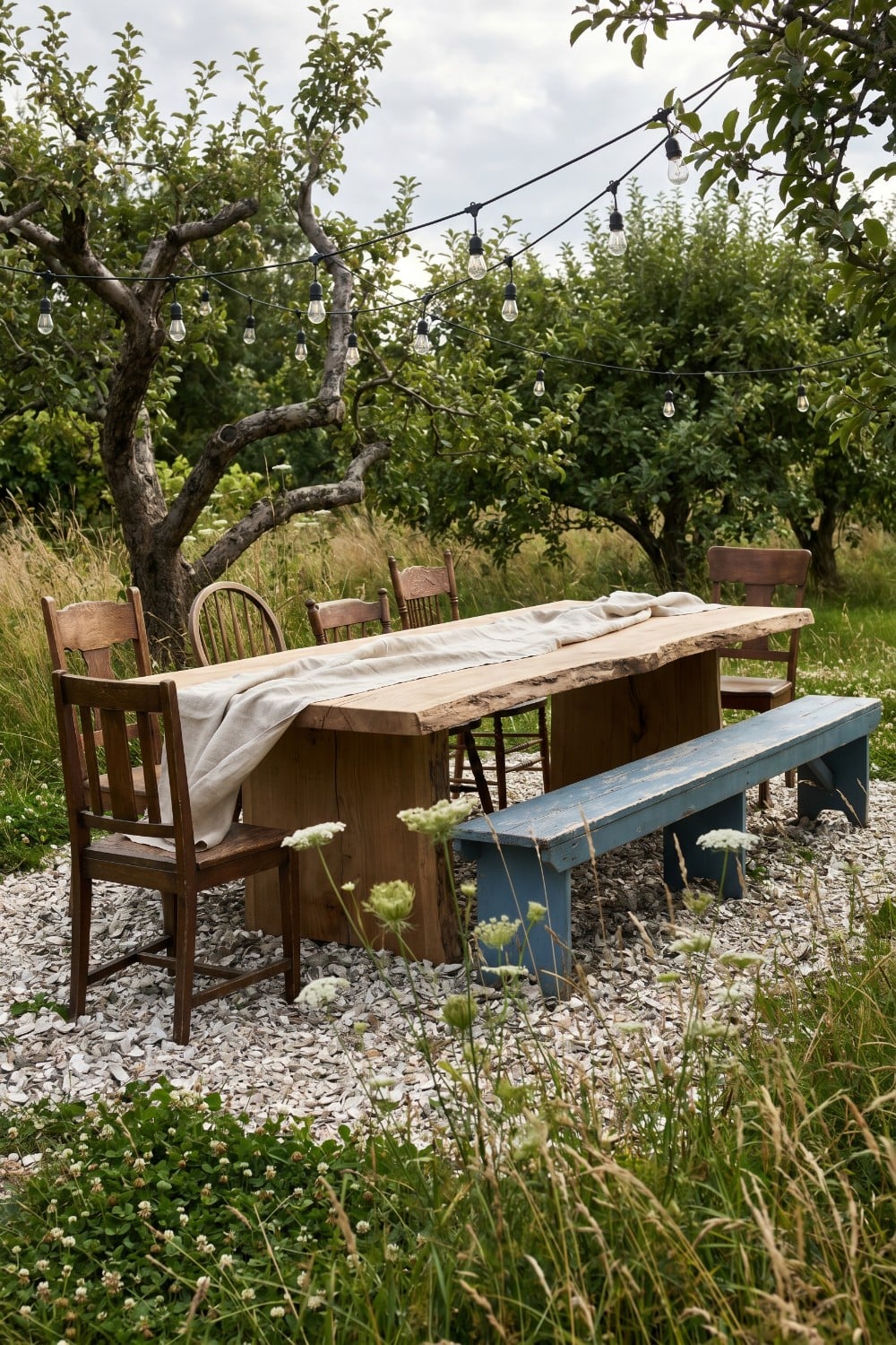 Live edge table and blue bench country yard
