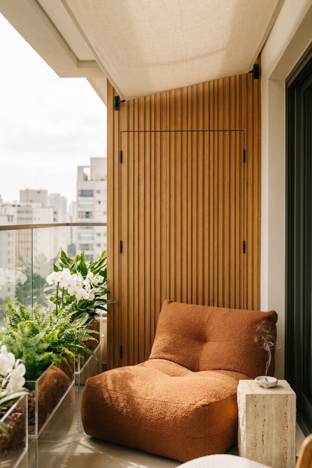 Flat balcony with slouched chair and acrylic planters