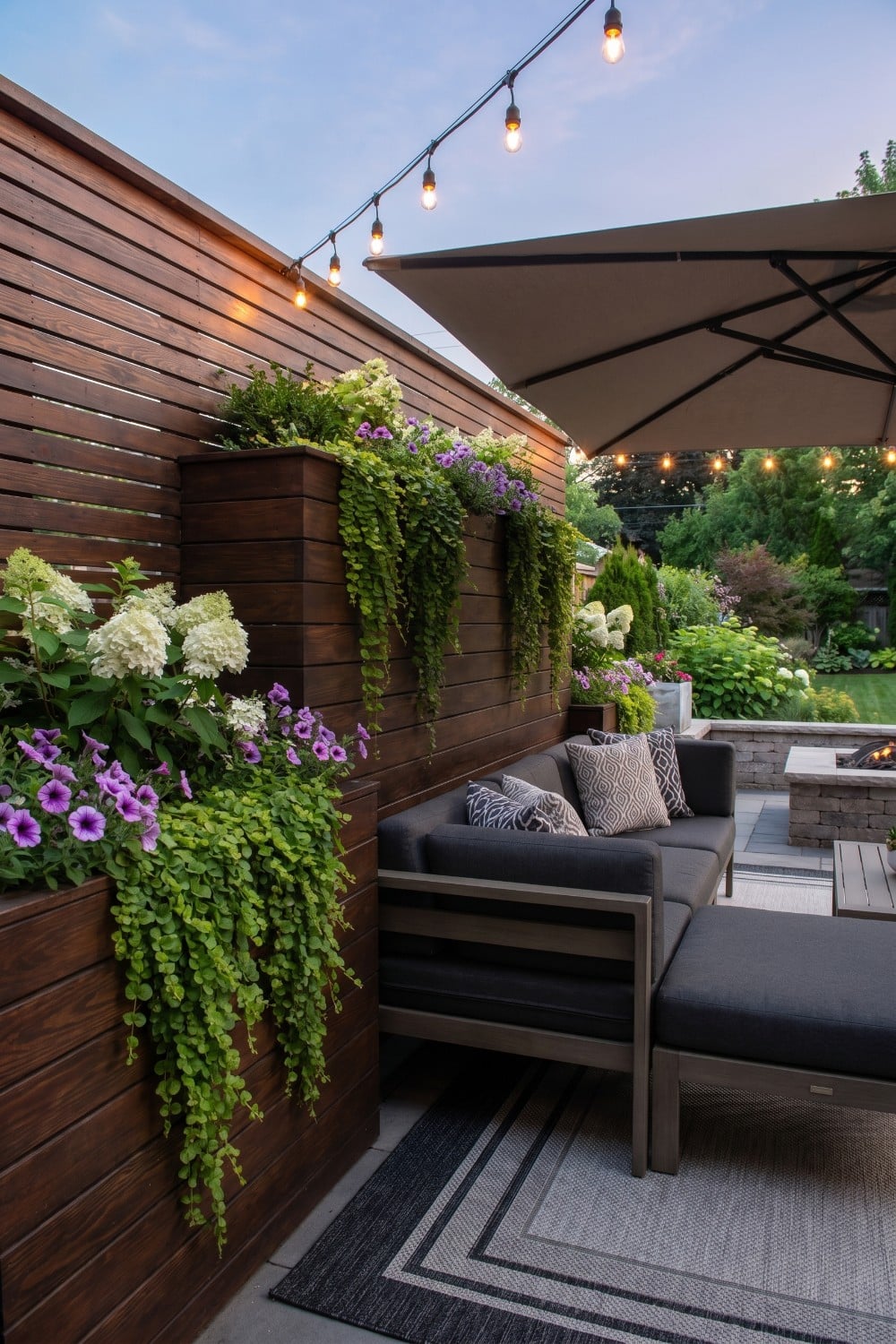 Patio Privacy Wall with Cascading Flowers and Lights