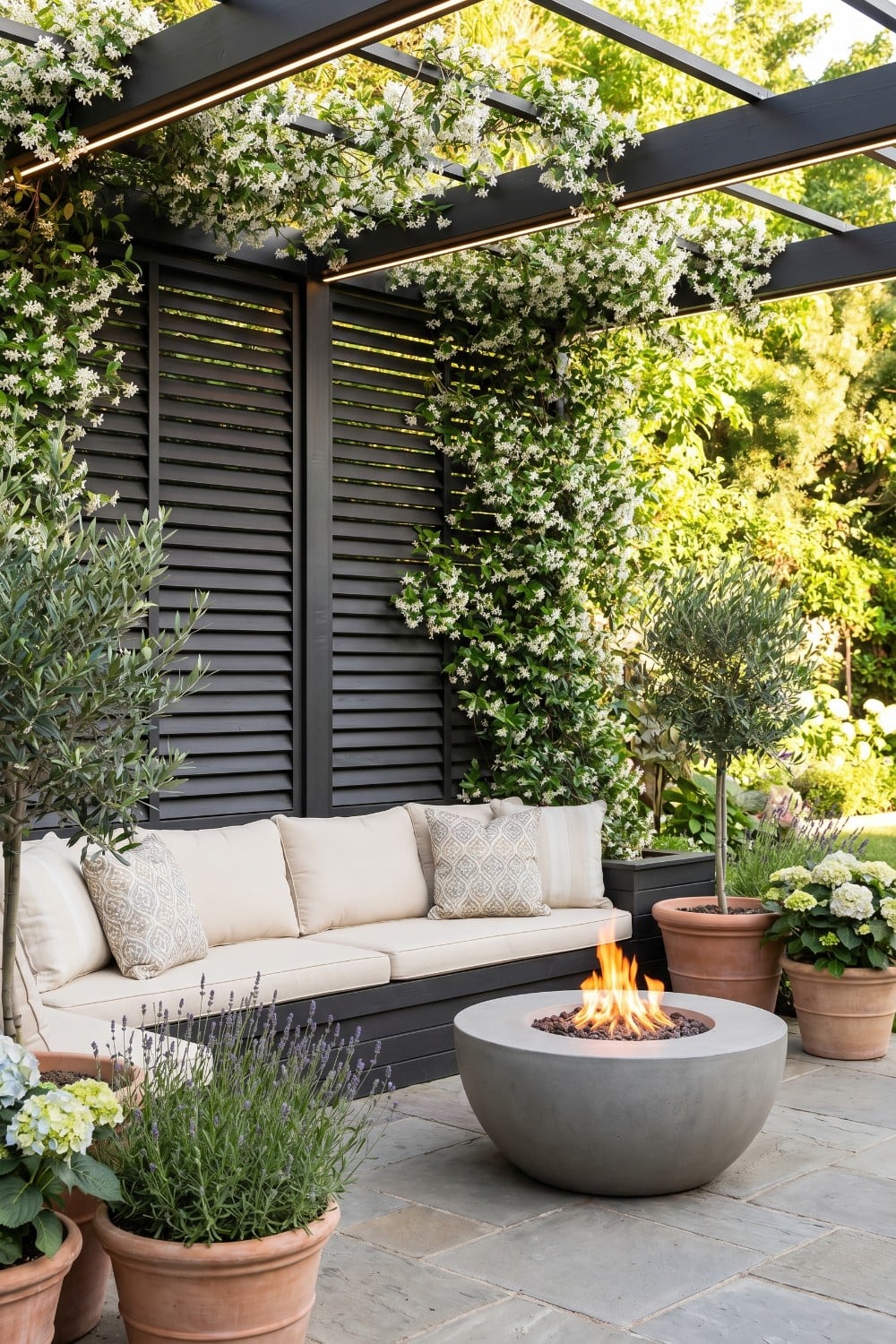 Black Louvered Patio Privacy and Concrete Fire Pit
