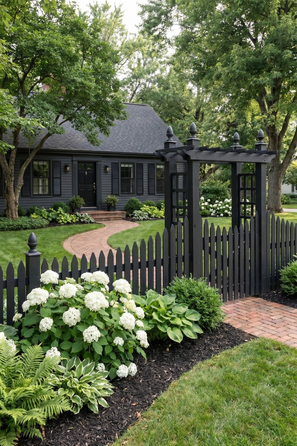 Charcoal picket fence and matching arbor