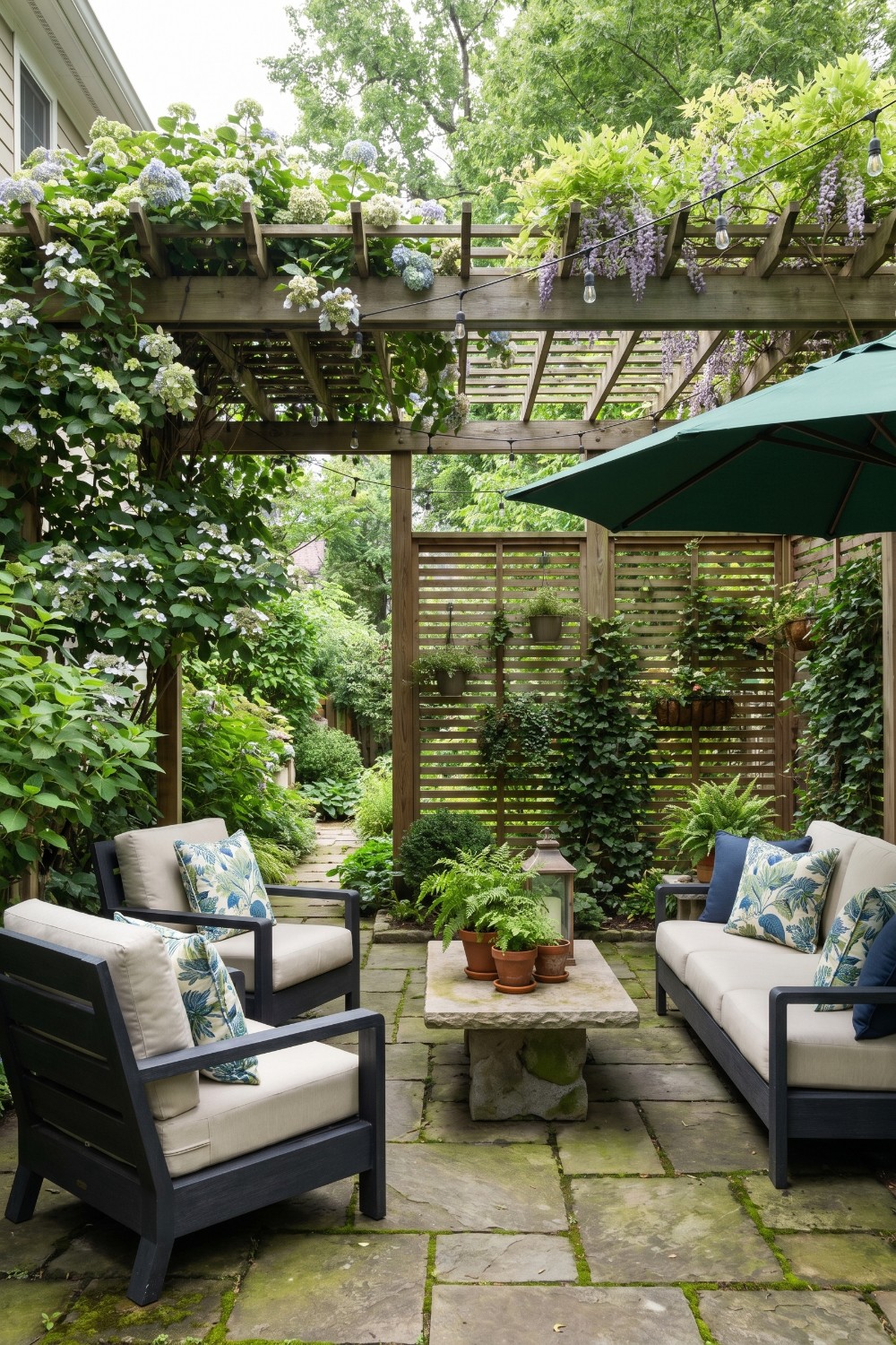 Shady patio with hydrangea pergola and stone table