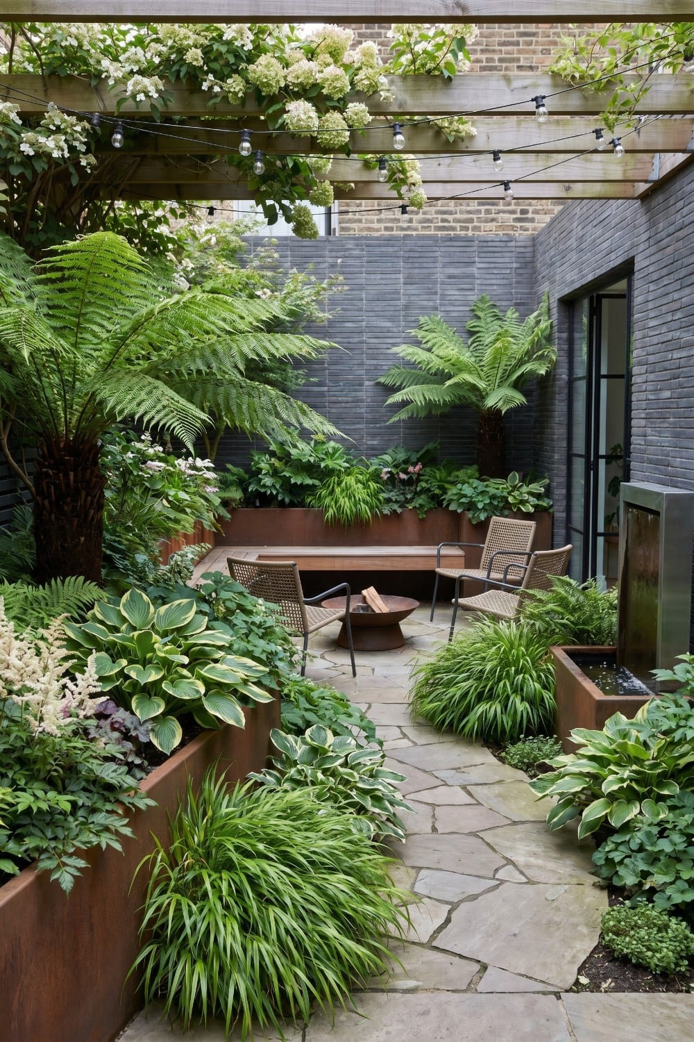 Shady patio with tree ferns and corten steel